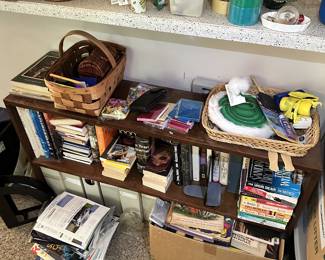 Books, media, baskets, and household shelving.
