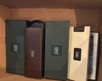 Cross pen and pencil gift sets in presentation cases.