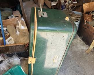 Green metal storage cabinet or case and workshop supplies.