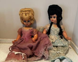 Assorted vintage dolls and character dolls in varied sizes and styles.