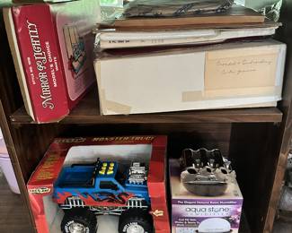 Model train, vintage-style toys, and boxed collectibles.