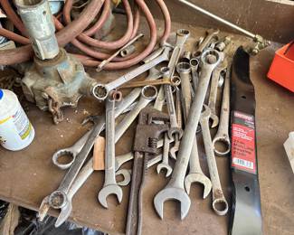 Large combination wrenches and hand tools.