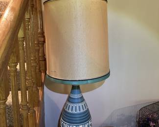 Table lamp with blue ceramic base.