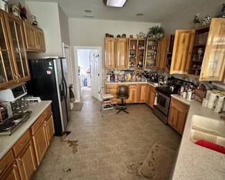Kitchen appliances, cabinets, and household items.