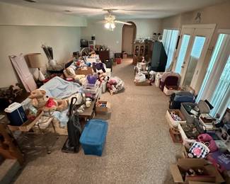Room filled with household goods, collectibles, and furnishings.