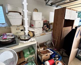 Household storage, small appliances, fan, and buckets.