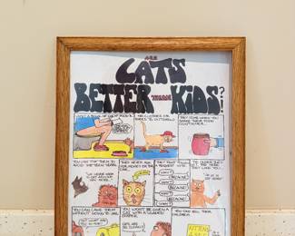 Framed novelty cat poster and wall art.