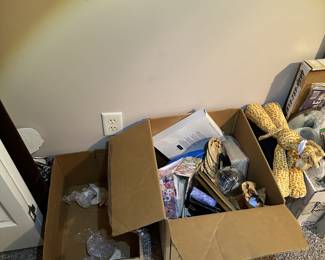 Bins of small appliances, electronics, and household goods.