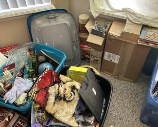 Tubs of decorative items, textiles, and household goods.