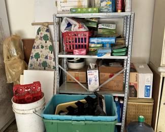 Utility shelves, household cleaners, and storage tubs.