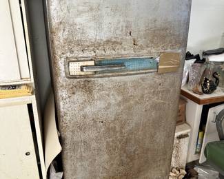 Vintage metal refrigerator or freezer appliance.