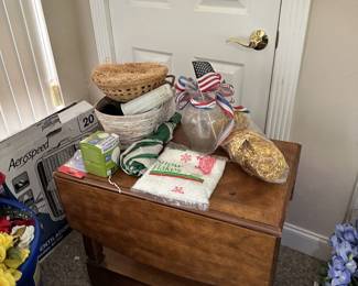 Baskets, linens, small household goods, and wood chest.