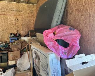 Green metal storage cabinets, boxes, and shop supplies.