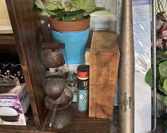 Plant pots, metal pieces, and household supplies.