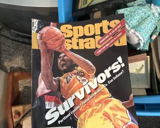 Michael Jordan Sports Illustrated magazines and basketball collectibles.