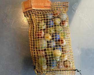 Vintage glass marbles in an original-style mesh bag.