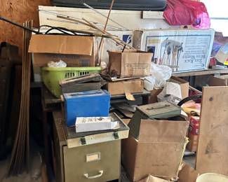 Metal filing cabinets, storage boxes, and workshop supplies.