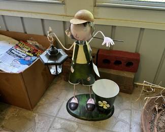 Metal golfer figurine and sports decor.