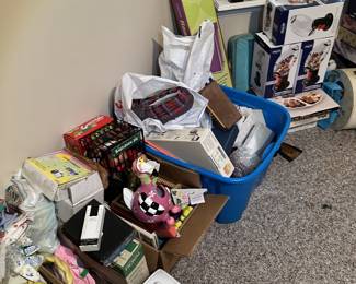 Small appliances, clocks, housewares, and boxed household items.