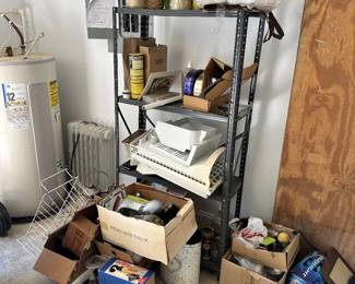 Water heater, utility shelving, and household supplies.