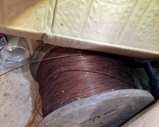 Spool of wire or cable and workshop supplies.