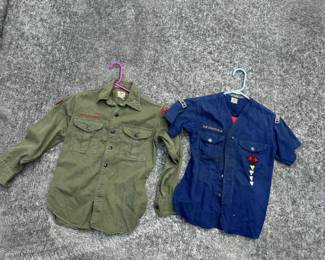 Vintage military-style uniforms, garment bags, and related clothing.