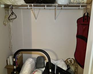 Closet storage, luggage, and household items.
