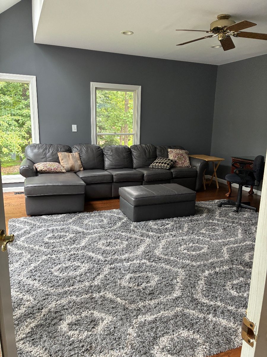 Leather couch with motorized ottoman