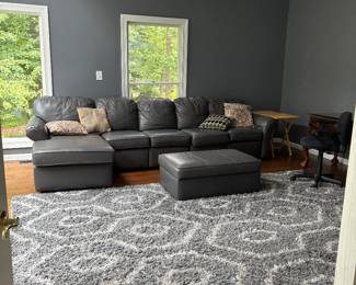 Leather couch with motorized ottoman