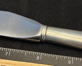 S37 - $50. Serrated knife, Sterling handle. Made in Sheffield, England  