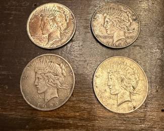 S64 - $55 Each. Peace Dollars. 1924, 1934, 1922, 1922. 