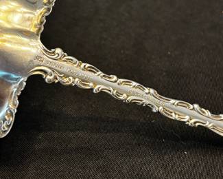S34 - $195. 128 grams, Cowell & Hubbard sterling silver ladle. Monogrammed "EBW"