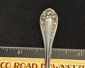 S8 - $25. 16 gram R. Wallace & Sons sterling spoon. Monogrammed "LU" or "LV" PAT.1898 Springborg.