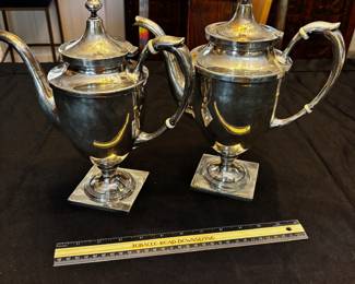 S39 - Sterling silver tea pots. (Left)$1,150. Smaller 798 grams.  Larger one (Right) $1400. 898 grams. Sterling silver tea pots. Monogrammed "EW". Smaller one has a broken lid.