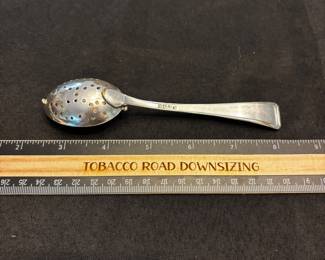 S10 - $75. 32 gram sterling silver tea infuser spoon.