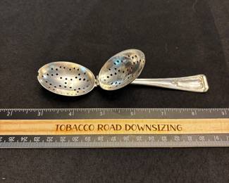 S10 - $75. 32 gram sterling silver tea infuser spoon.