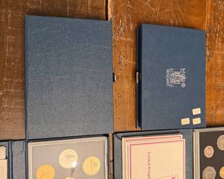 S56 - $150. Set of 8 United Kingdom Proof Coin Collections. 1983, 84, 85, 87, 88, 89, 91, 93. 
