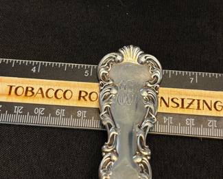 S34 - $195. 128 grams, Cowell & Hubbard sterling silver ladle. Monogrammed "EBW"