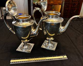 S39 - Sterling silver tea pots. (Left)$1,150. Smaller 798 grams.  Larger one (Right) $1400. 898 grams. Sterling silver tea pots. Monogrammed "EW". Smaller one has a broken lid.