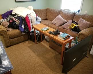 Sectional sofa; coffee table; TV; clothes