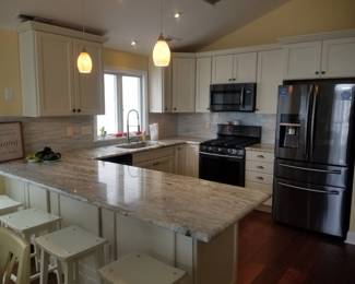 Beautiful kitchen with WOLF cabinetry and a Samsung appliance suite