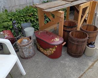 Wooden saw horses, nail barrels,