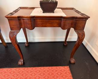 Chippendale-style mahogany tray-top side table, shaped top on conforming case, carved cabriole legs terminating in ball and claw feet . Veneer loss to tabletop  27"h x 33"w x 20"d 