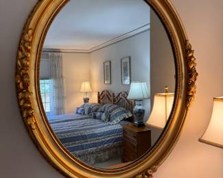 Victorian style, oval gilt wood frame mirror with carved florals and fruits  35"h x 30"w 