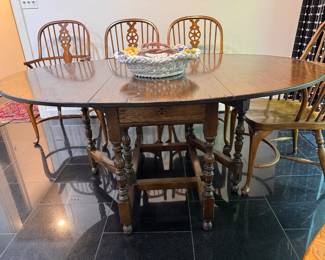 English oak gate leg table     29.5"h x 66"long x 48"d 