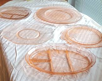 Pink depression glass plates and platters