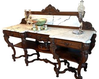 Amazing antique sideboard with marble top and backsplash in excellent condition. Measures 59"H x 84"W x 40"H (to top of table) x 26"D