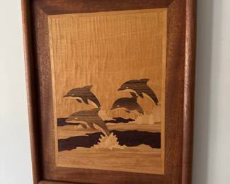 Marquetry wood inlay of dolphins