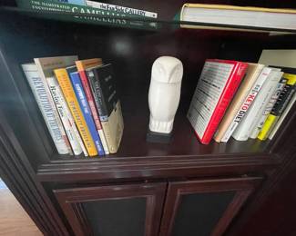 Stone owl on base, cook books