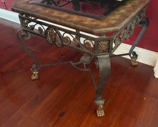 Pair of ornate, heavy wrought iron side table with glass inserts